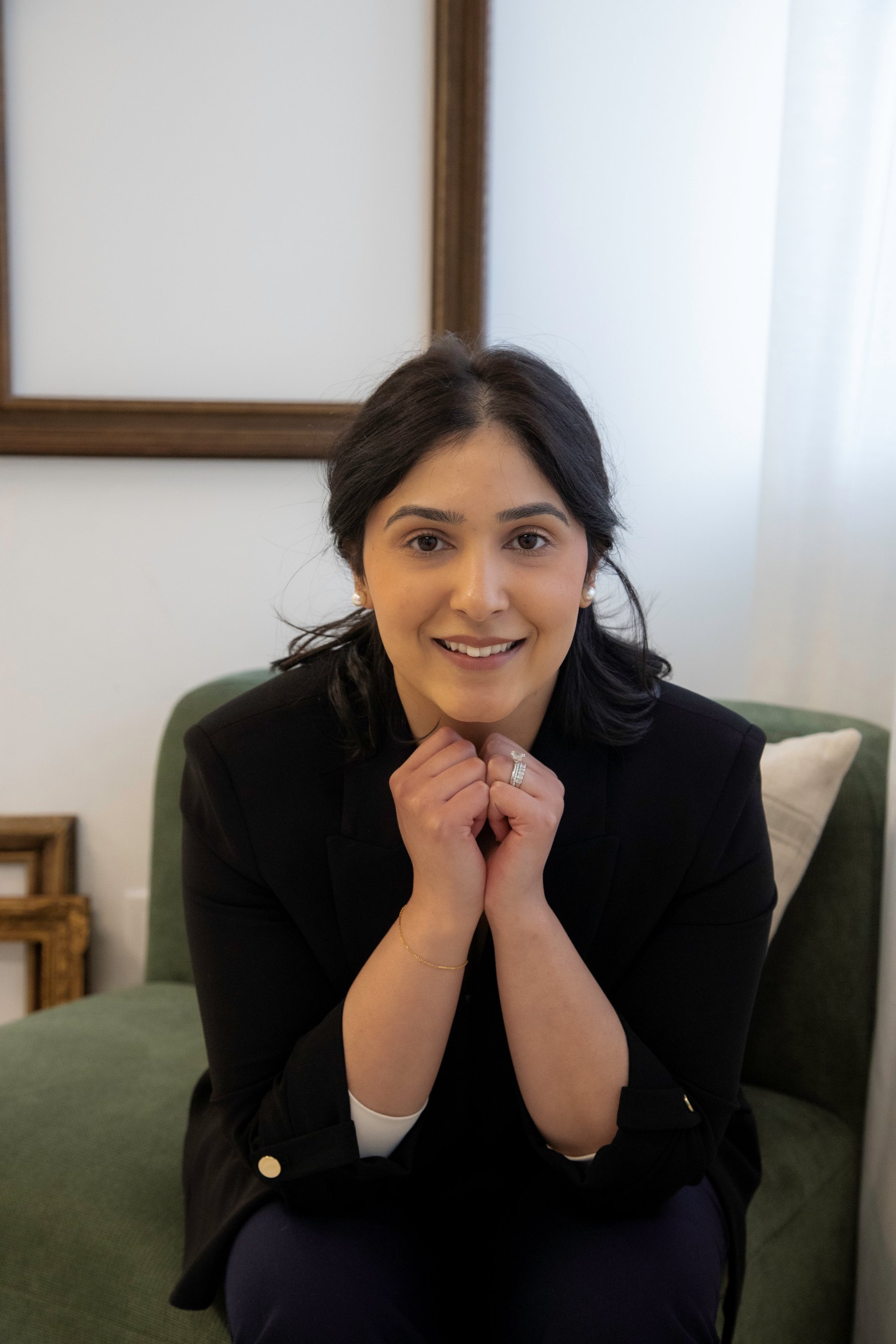 Monica Bhullar-Sandhu in a warm, welcoming therapy setting